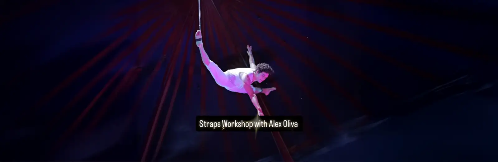 Aerialist Alex Oliva performing an aerial straps move under a circus tent—Cirque Art Studio workshop promo.
